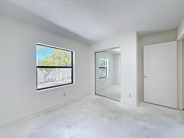 5701 Autumn Ridge Rd, Lake Worth, FL 33463 - unfurnished bedroom with a textured ceiling and a closet