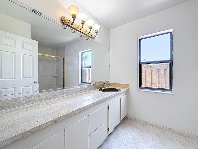 5701 Autumn Ridge Rd, Lake Worth, FL 33463 - bathroom featuring tiled shower, marble finish flooring, vanity, and baseboards