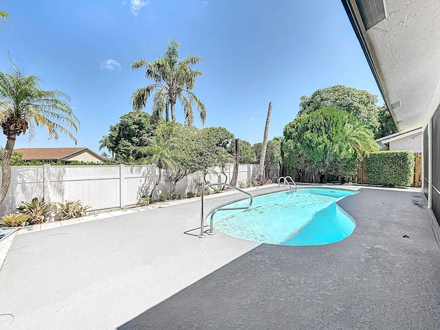 5701 Autumn Ridge Rd, Lake Worth, FL 33463 - view of swimming pool featuring a patio area and a fenced backyard