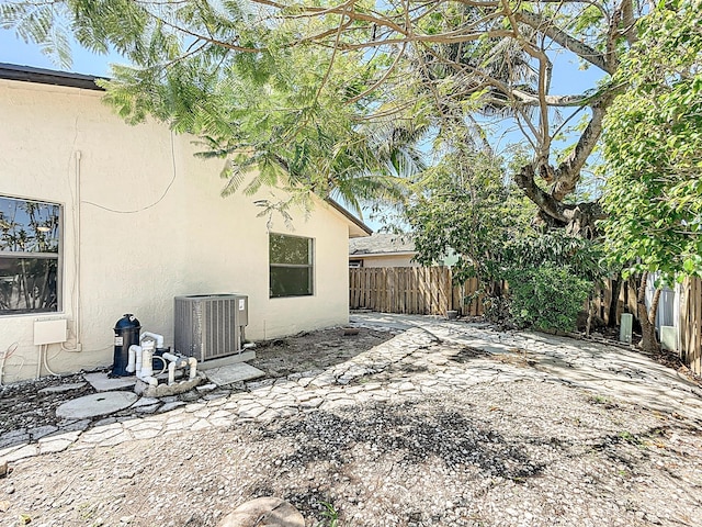 5701 Autumn Ridge Rd, Lake Worth, FL 33463 - fenced backyard with cooling unit and a patio