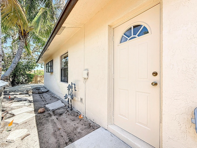 5701 Autumn Ridge Rd, Lake Worth, FL 33463 - entrance to property featuring stucco siding and fence