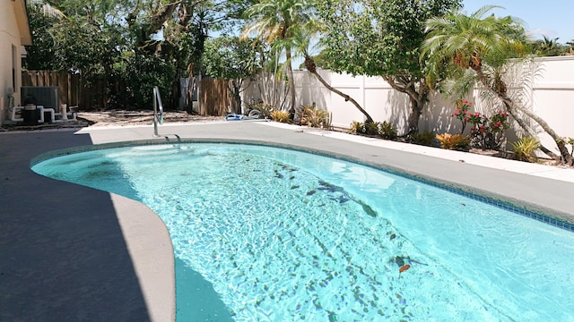 5701 Autumn Ridge Rd, Lake Worth, FL 33463 - view of swimming pool with a fenced backyard, a patio area, and central air condition unit
