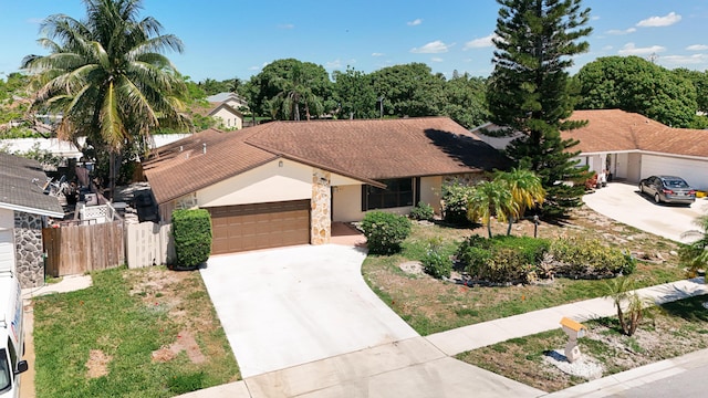 5701 Autumn Ridge Rd, Lake Worth, FL 33463 - single story home featuring an attached garage, concrete driveway, fence, and stucco siding