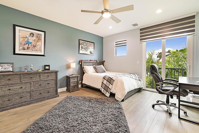 311 SE 11th St, Pompano Beach, FL 33060 - bedroom featuring access to exterior, light wood-style flooring, a desk, recessed lighting, and a ceiling fan