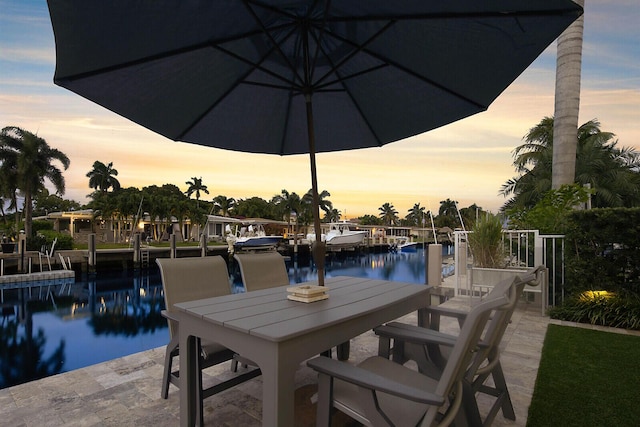 311 SE 11th St, Pompano Beach, FL 33060 - patio terrace at dusk with a water view and a boat dock