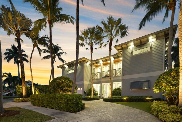 311 SE 11th St, Pompano Beach, FL 33060 - property at dusk with decorative driveway