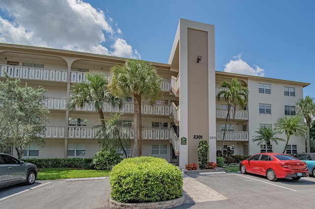 2301 Lucaya Ln Unit M3, Coconut Creek, FL 33066 - view of apartment building / complex featuring uncovered parking