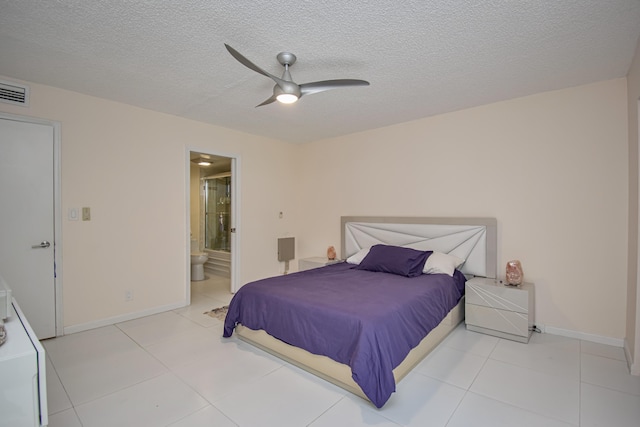 2301 Lucaya Ln Unit M3, Coconut Creek, FL 33066 - bedroom featuring baseboards, a textured ceiling, connected bathroom, light tile patterned floors, and ceiling fan