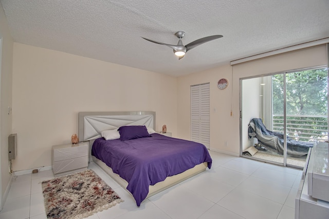 2301 Lucaya Ln Unit M3, Coconut Creek, FL 33066 - bedroom featuring access to outside, a textured ceiling, a ceiling fan, a closet, and light tile patterned floors