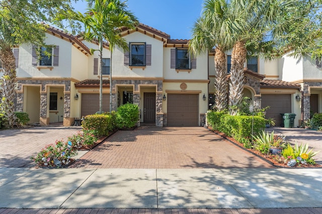 4080 Devenshire Ct, Coconut Creek, FL 33073 - view of front of property featuring stone siding, stucco siding, driveway, a garage, and a tile roof
