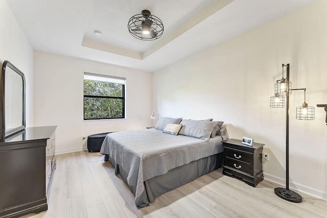 4080 Devenshire Ct, Coconut Creek, FL 33073 - bedroom featuring light wood-style flooring, baseboards, and a raised ceiling