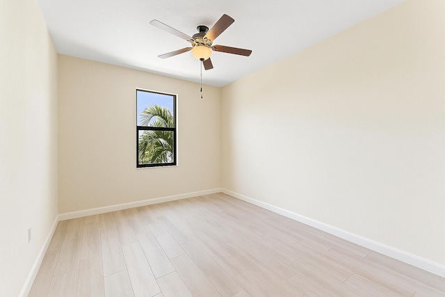 4080 Devenshire Ct, Coconut Creek, FL 33073 - empty room featuring a ceiling fan, light wood-style floors, and baseboards