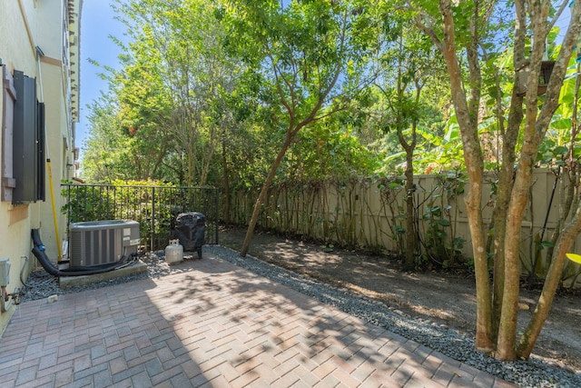 4080 Devenshire Ct, Coconut Creek, FL 33073 - view of patio / terrace with central AC and a fenced backyard