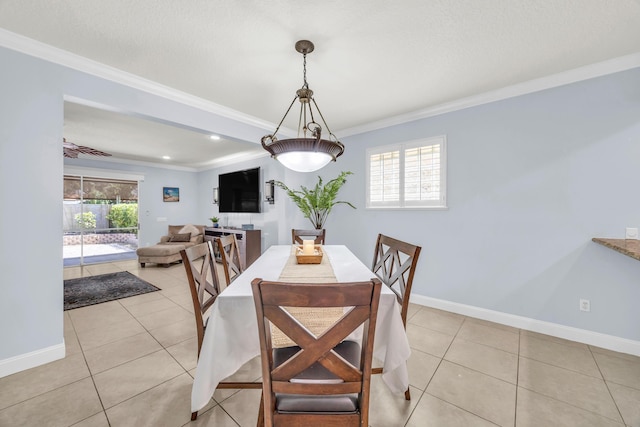 148 Cypress Cv, Jupiter, FL 33458 - dining room with crown molding, light tile patterned flooring, and baseboards