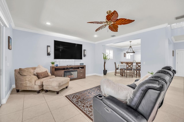 148 Cypress Cv, Jupiter, FL 33458 - living area with crown molding, light tile patterned flooring, baseboards, recessed lighting, and ceiling fan