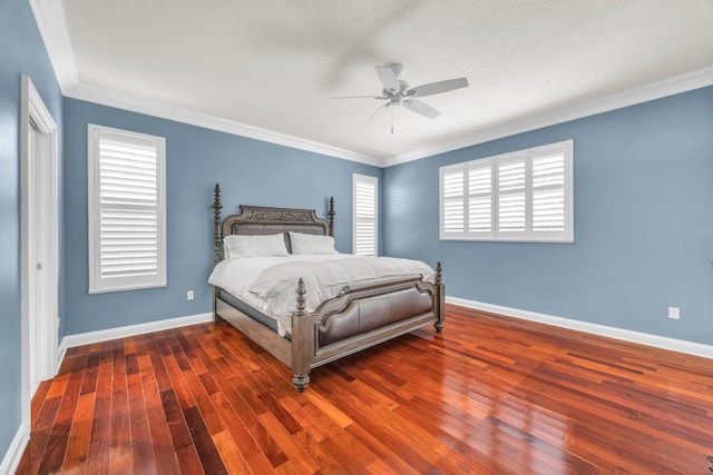 148 Cypress Cv, Jupiter, FL 33458 - bedroom with wood finished floors, baseboards, crown molding, and a ceiling fan