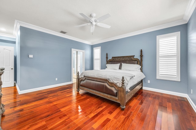 148 Cypress Cv, Jupiter, FL 33458 - bedroom featuring wood finished floors, baseboards, crown molding, and a ceiling fan