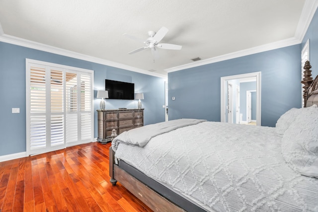148 Cypress Cv, Jupiter, FL 33458 - bedroom with wood finished floors, ornamental molding, baseboards, and a ceiling fan