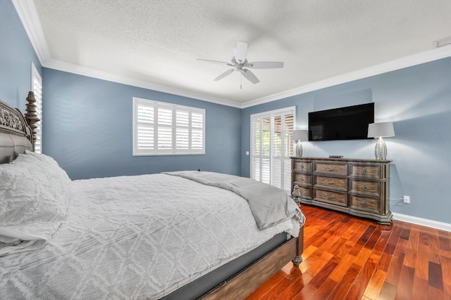 148 Cypress Cv, Jupiter, FL 33458 - bedroom with crown molding, wood finished floors, baseboards, a textured ceiling, and a ceiling fan