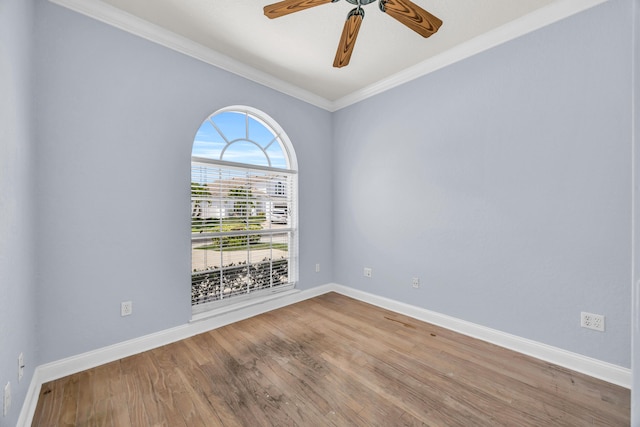 148 Cypress Cv, Jupiter, FL 33458 - unfurnished room with crown molding, wood finished floors, baseboards, and a ceiling fan