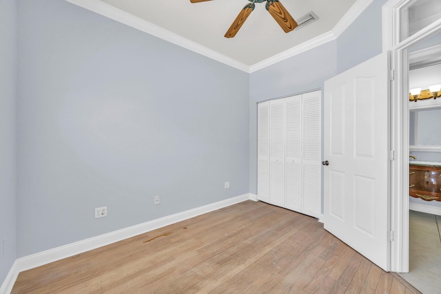 148 Cypress Cv, Jupiter, FL 33458 - unfurnished bedroom featuring ornamental molding, light wood-type flooring, baseboards, a closet, and ceiling fan