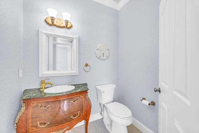 148 Cypress Cv, Jupiter, FL 33458 - bathroom featuring ornamental molding, vanity, toilet, tile patterned floors, and baseboards