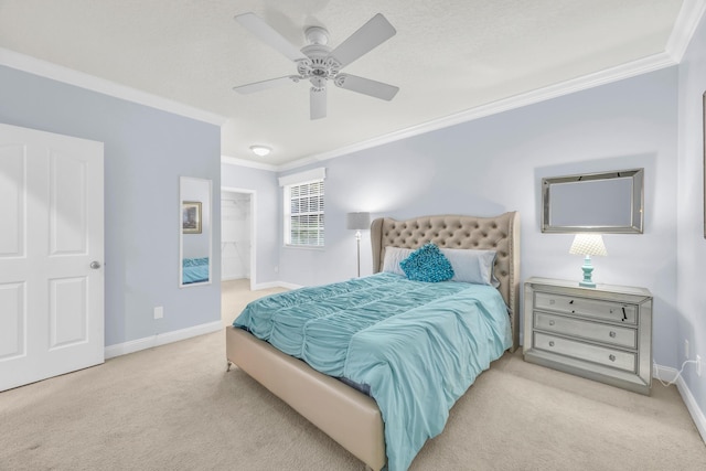 148 Cypress Cv, Jupiter, FL 33458 - carpeted bedroom featuring ornamental molding, baseboards, a walk in closet, and a ceiling fan