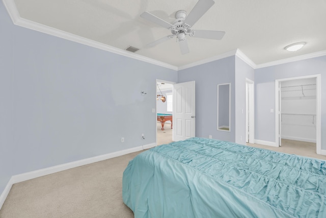 148 Cypress Cv, Jupiter, FL 33458 - carpeted bedroom featuring ornamental molding, baseboards, a ceiling fan, and a spacious closet