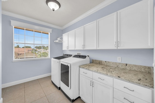 148 Cypress Cv, Jupiter, FL 33458 - clothes washing area with cabinet space, washer and clothes dryer, baseboards, crown molding, and light tile patterned flooring