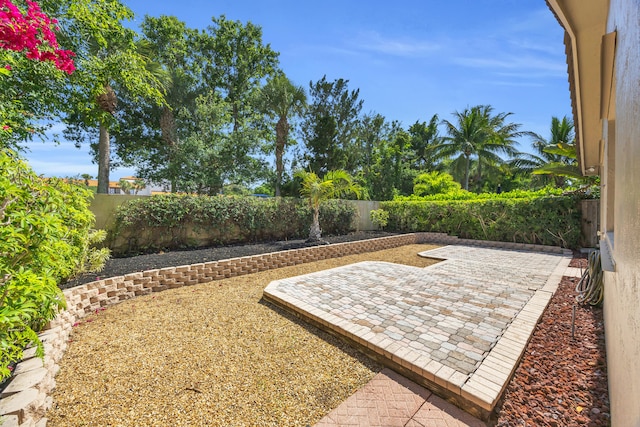 148 Cypress Cv, Jupiter, FL 33458 - fenced backyard with a patio
