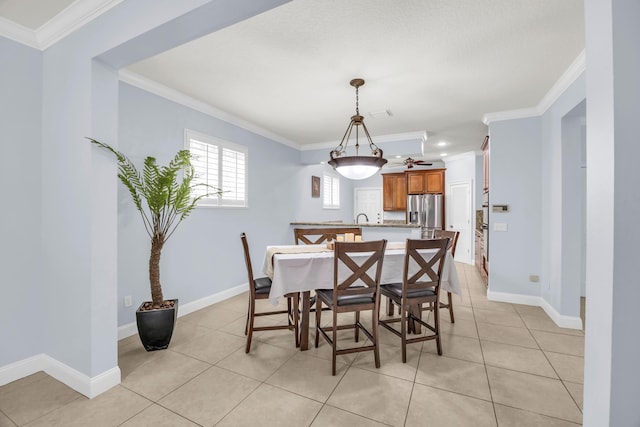 148 Cypress Cv, Jupiter, FL 33458 - dining room with ornamental molding, light tile patterned floors, and baseboards