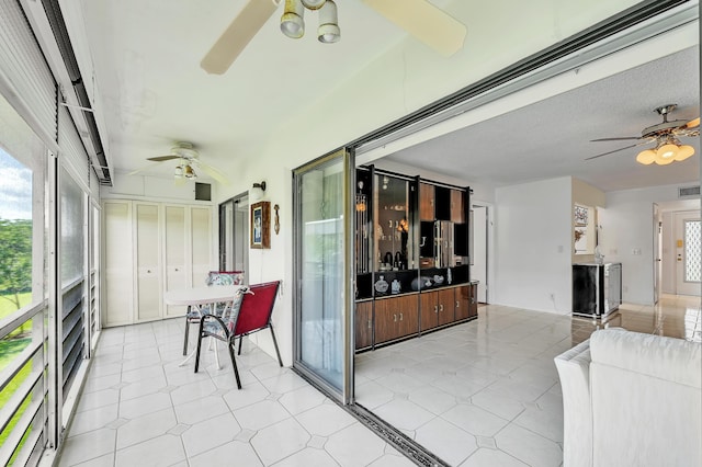 128 Capri C, Delray Beach, FL 33484 - sunroom with ceiling fan