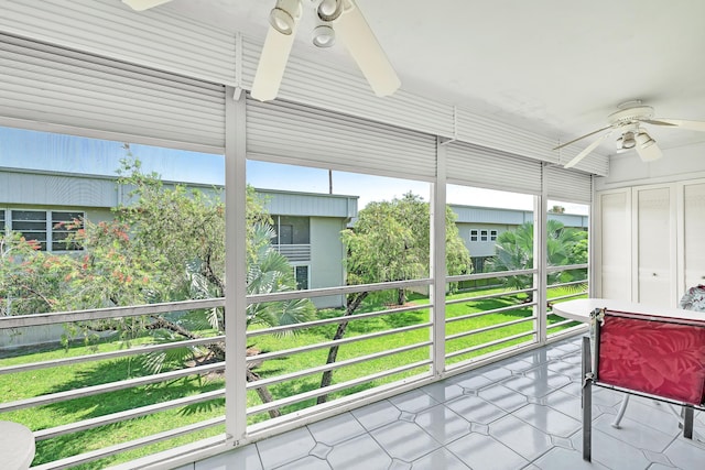 128 Capri C, Delray Beach, FL 33484 - sunroom / solarium featuring a ceiling fan