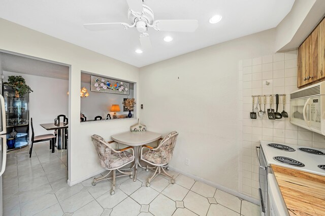128 Capri C, Delray Beach, FL 33484 - dining room with ceiling fan, recessed lighting, and baseboards