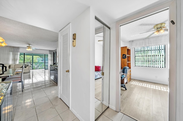 128 Capri C, Delray Beach, FL 33484 - corridor with a textured ceiling and baseboards