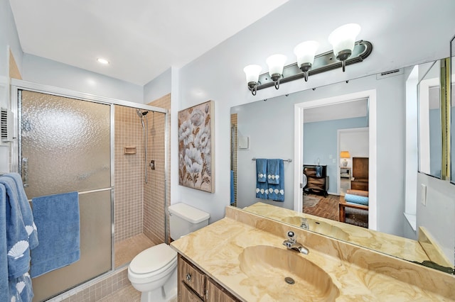 128 Capri C, Delray Beach, FL 33484 - full bathroom featuring toilet, a shower stall, ensuite bath, and vanity