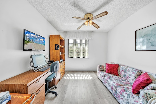 128 Capri C, Delray Beach, FL 33484 - office featuring a textured ceiling, ceiling fan, and light wood-style floors