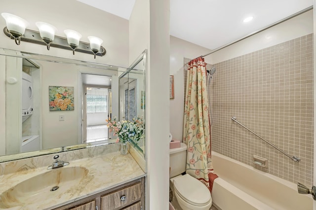 128 Capri C, Delray Beach, FL 33484 - full bathroom with toilet, stacked washer / dryer, shower / bath combo, and vanity