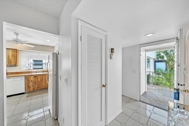 128 Capri C, Delray Beach, FL 33484 - foyer entrance featuring ceiling fan, baseboards, and recessed lighting