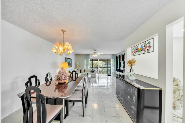 128 Capri C, Delray Beach, FL 33484 - dining area featuring a chandelier and a textured ceiling
