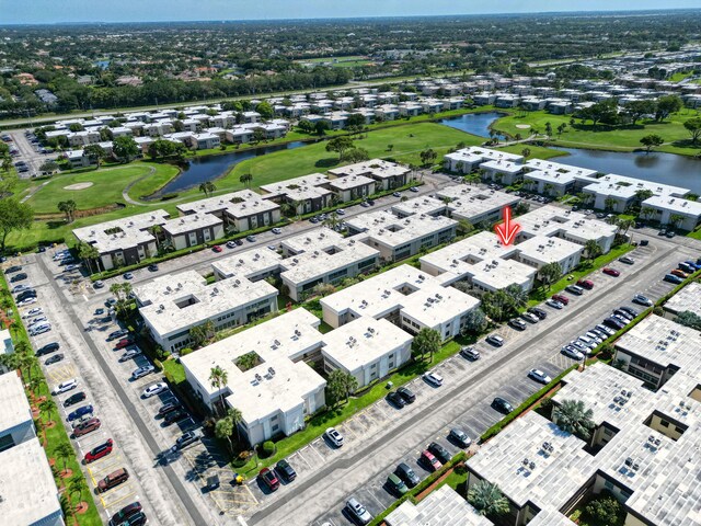 128 Capri C, Delray Beach, FL 33484 - bird's eye view of a golf club, a nearby body of water, and apartment complex / building