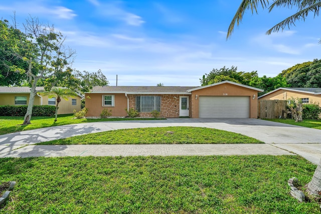 318 Gale Pl, West Palm Beach, FL 33409 - single story home with concrete driveway, an attached garage, and stucco siding
