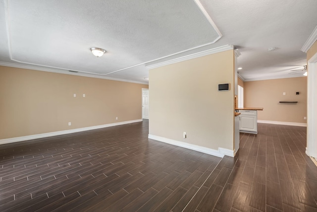318 Gale Pl, West Palm Beach, FL 33409 - unfurnished room featuring ornamental molding, baseboards, dark wood-type flooring, a textured ceiling, and a smoke detector