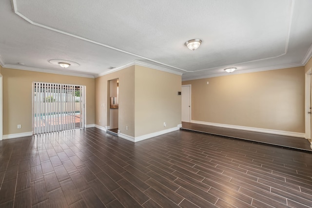 318 Gale Pl, West Palm Beach, FL 33409 - spare room featuring a textured ceiling, baseboards, dark wood-style flooring, and crown molding