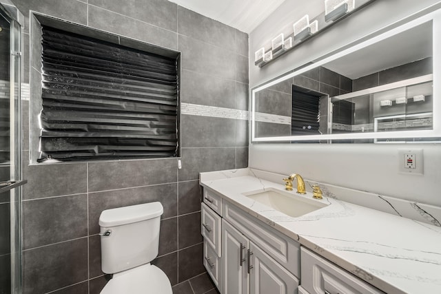 318 Gale Pl, West Palm Beach, FL 33409 - bathroom featuring tile walls, vanity, and toilet