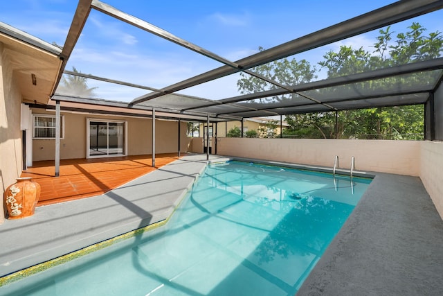 318 Gale Pl, West Palm Beach, FL 33409 - swimming pool featuring a wooden deck and glass enclosure
