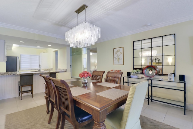 dining space with light tile patterned floors, a chandelier, and crown molding
