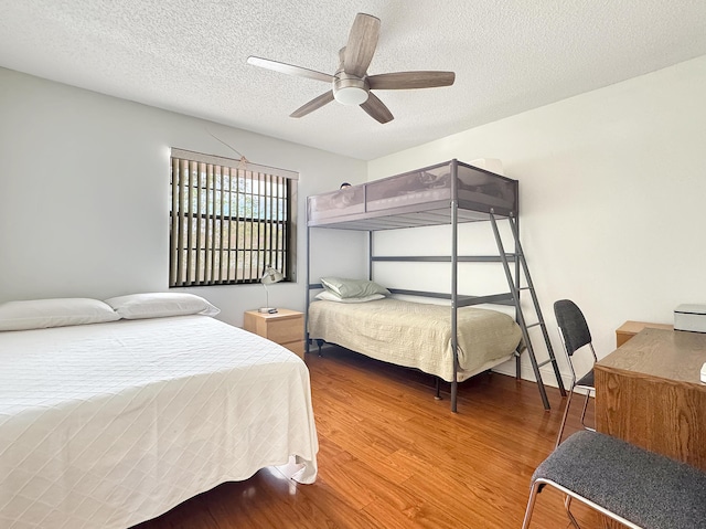4960 E Sabal Palm Blvd Unit 206, Tamarac, FL 33319 - bedroom with wood finished floors, a textured ceiling, and ceiling fan
