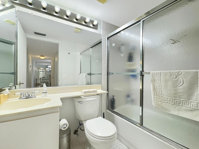 4960 E Sabal Palm Blvd Unit 206, Tamarac, FL 33319 - bathroom featuring tile patterned floors, enclosed tub / shower combo, vanity, and toilet
