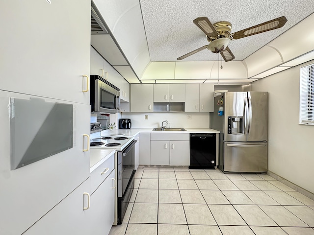 4960 E Sabal Palm Blvd Unit 206, Tamarac, FL 33319 - kitchen featuring stainless steel appliances, a sink, light countertops, ceiling fan, and a textured ceiling